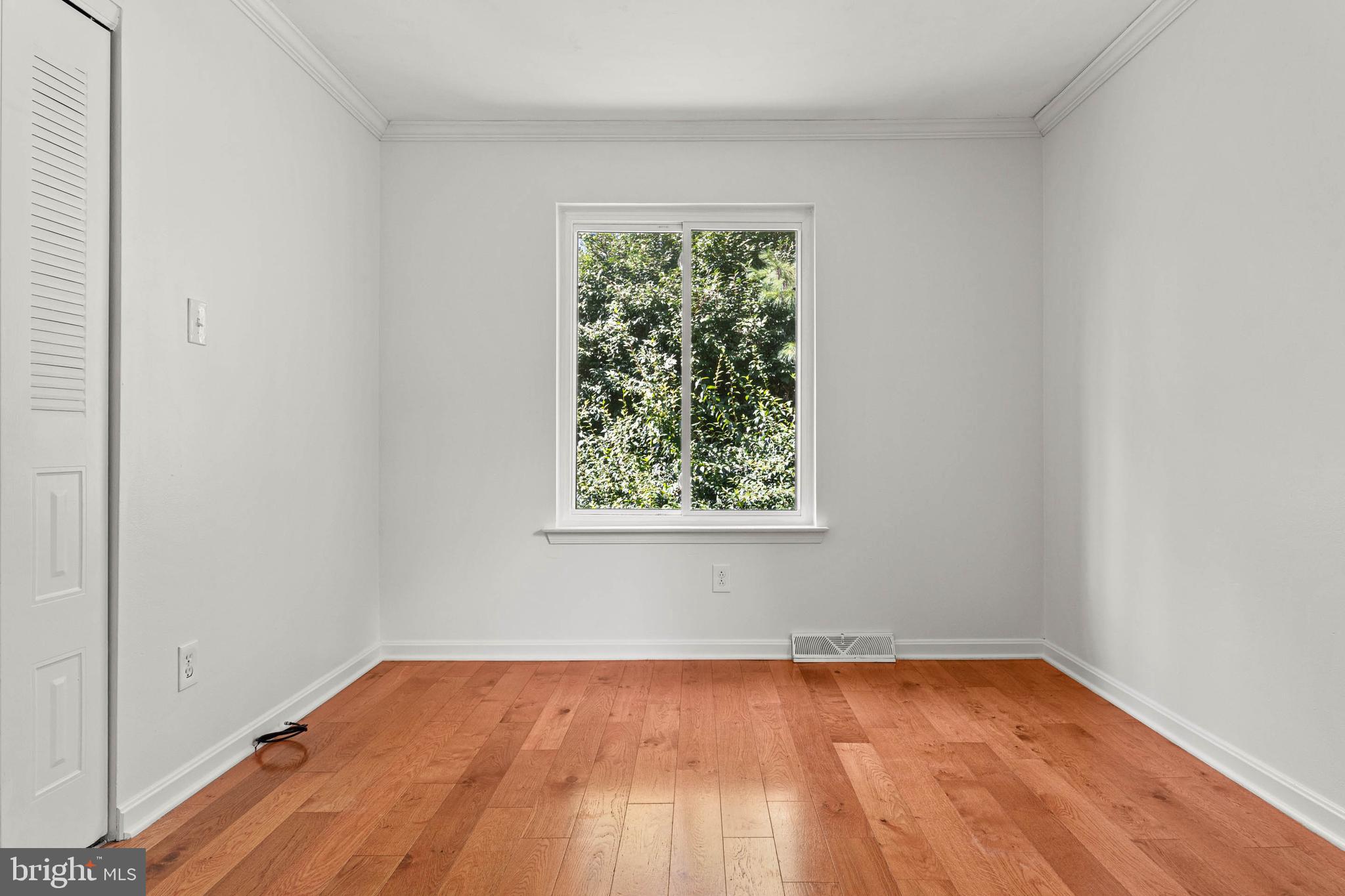 106 Bernard Court Chesterbrook, PA 19087 - Photo 19 of 30 a view of an empty room with wooden floor and a window
