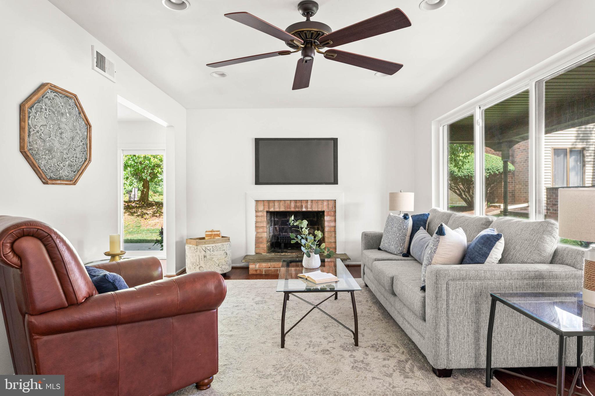 106 Bernard Court Chesterbrook, PA 19087 - Photo 5 of 30 a living room with furniture a fireplace and a large window