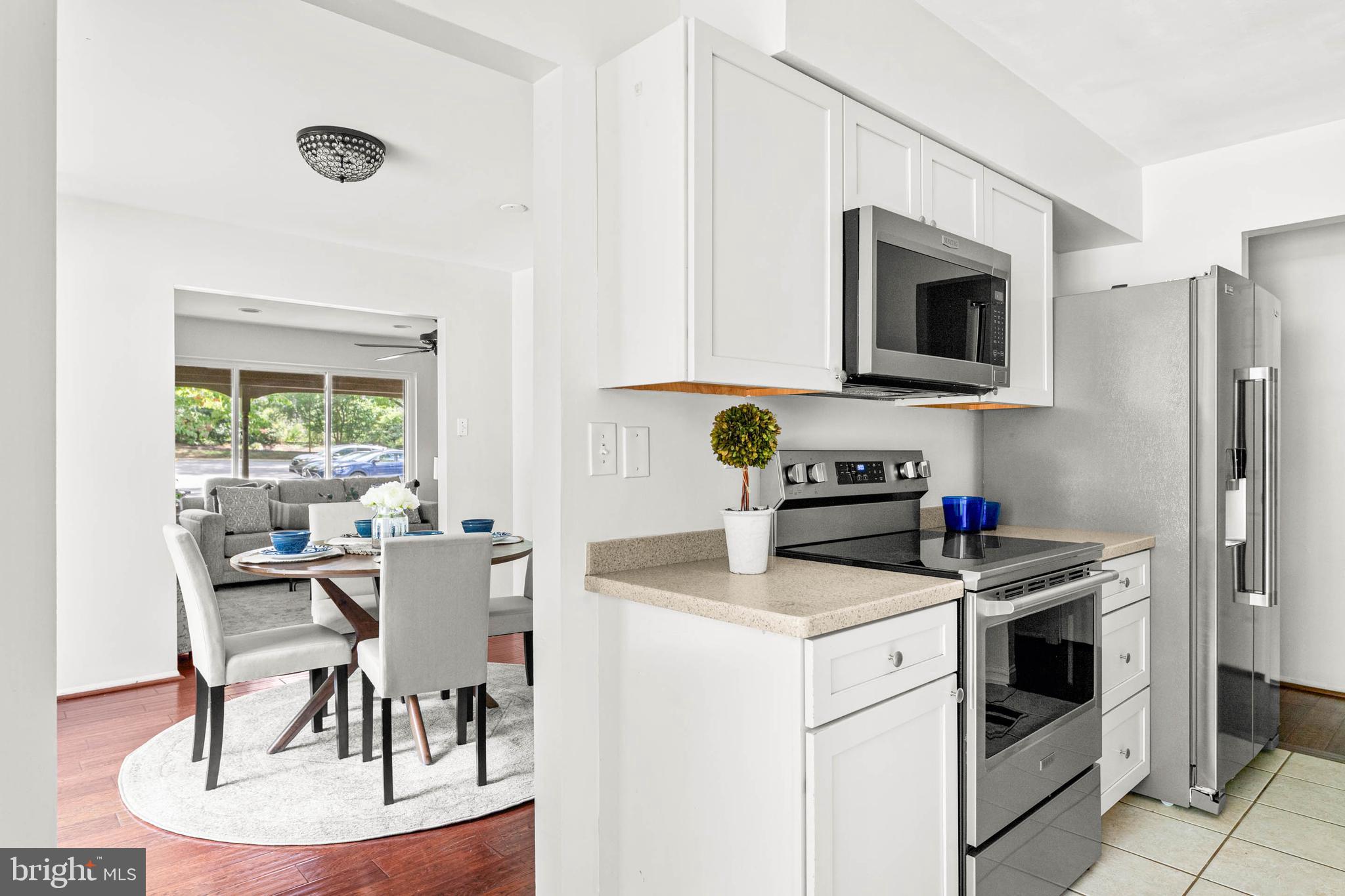 106 Bernard Court Chesterbrook, PA 19087 - Photo 10 of 30 a kitchen with a stove a sink and a microwave