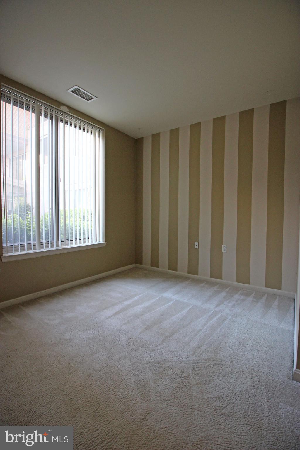 2726 Gallows Road, Unit 112 Vienna, VA 22180 - Photo 11 of 27 a view of an empty room with a window