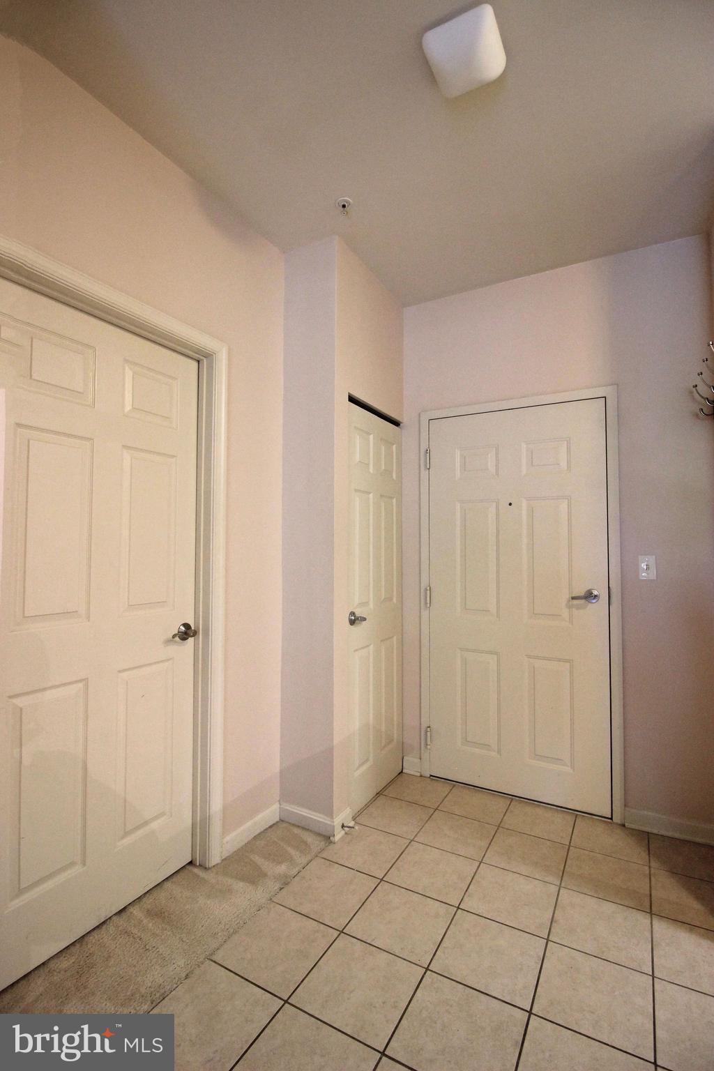 2726 Gallows Road, Unit 112 Vienna, VA 22180 - Photo 20 of 27 a view of a livingroom with an empty space