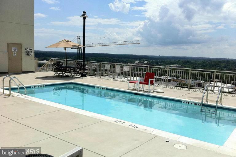 2726 Gallows Road, Unit 112 Vienna, VA 22180 - Photo 27 of 27 a swimming pool view with a lake view
