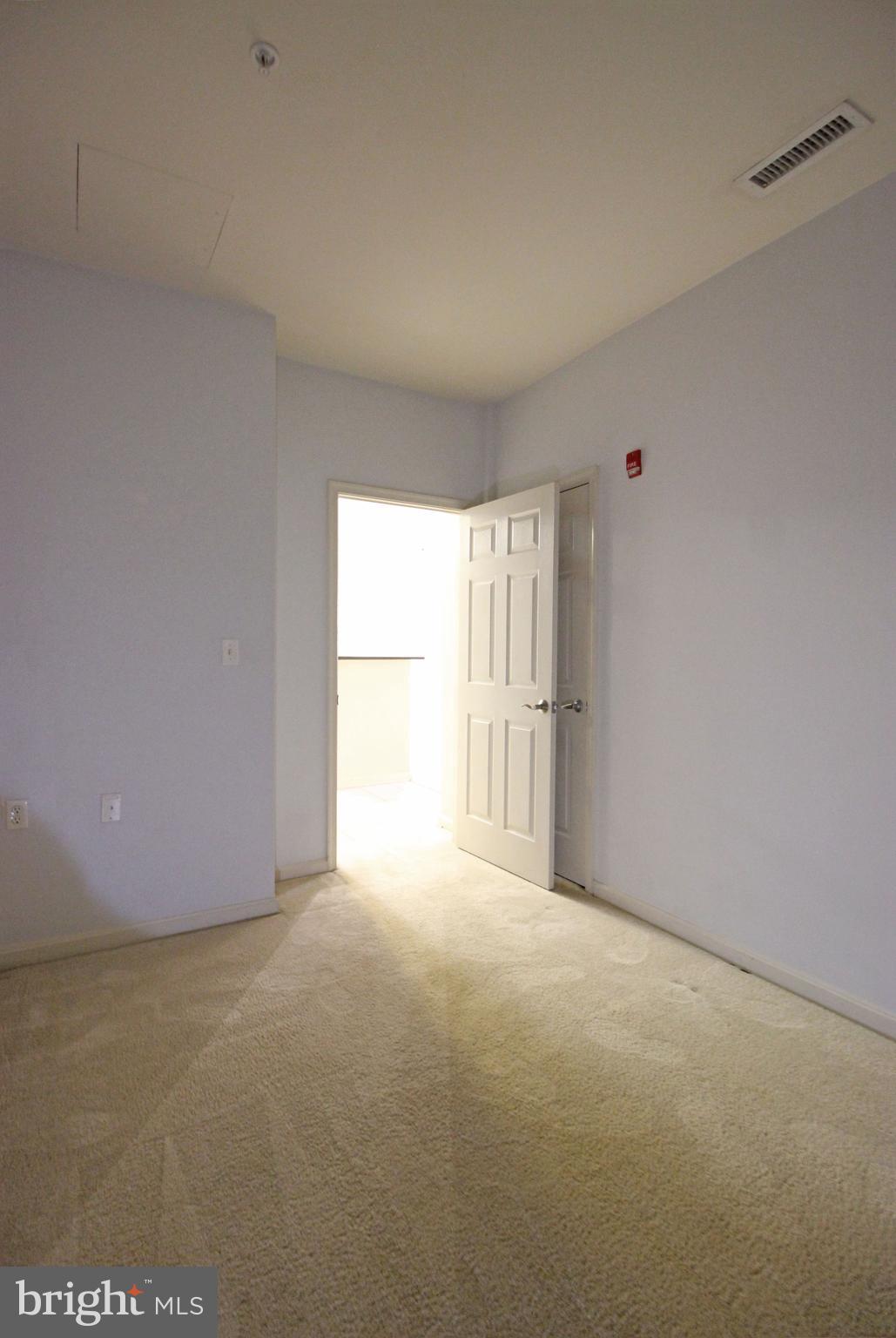 2726 Gallows Road, Unit 112 Vienna, VA 22180 - Photo 10 of 27 a view of an empty room with a window