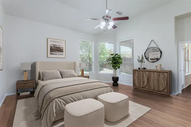 a living room with furniture a chandelier and a window