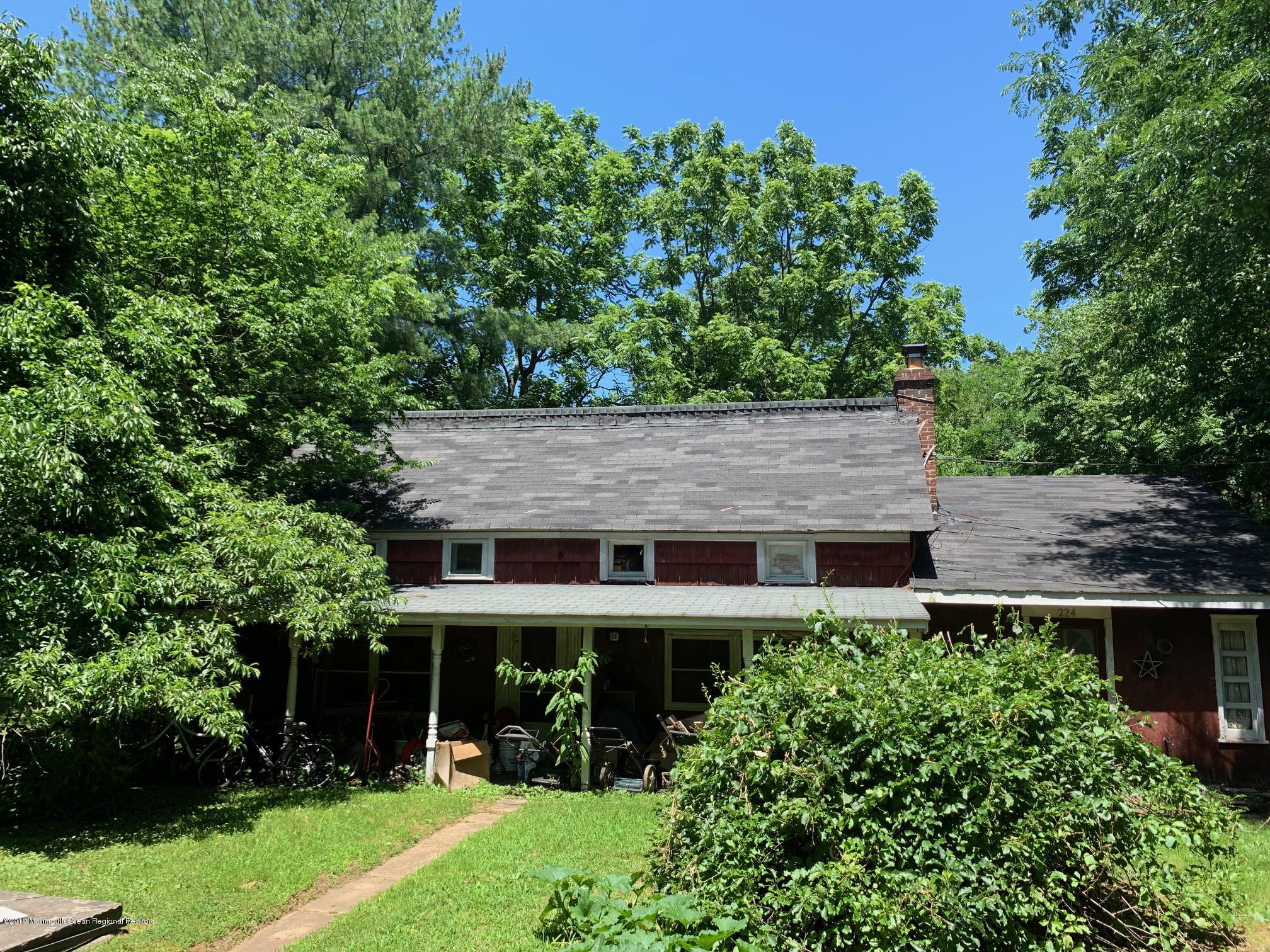 224 Tennent Road Morganville, NJ 07751 - Photo 3 of 3 front view of a house with a yard