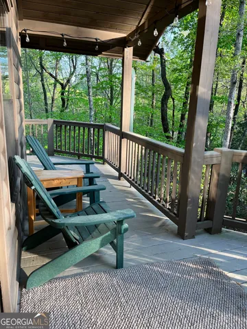 a view of a two chairs in the balcony