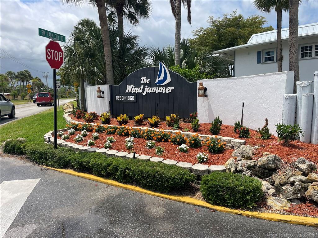 1858 Southwest Palm City Road, Unit 203 Stuart, FL 34994 - Photo 21 of 21 a view of a bunch of flowers and a street sign