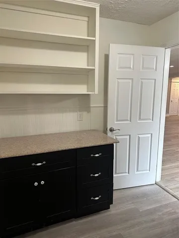 a room with a cabinets and a wooden floor