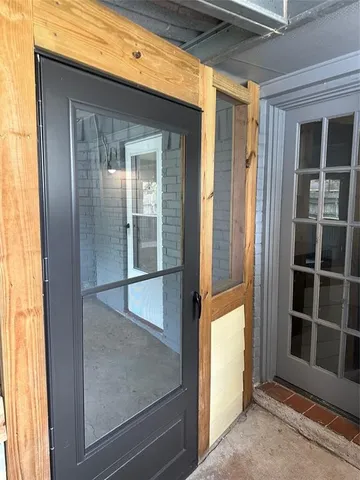 a view of a room with wooden walls