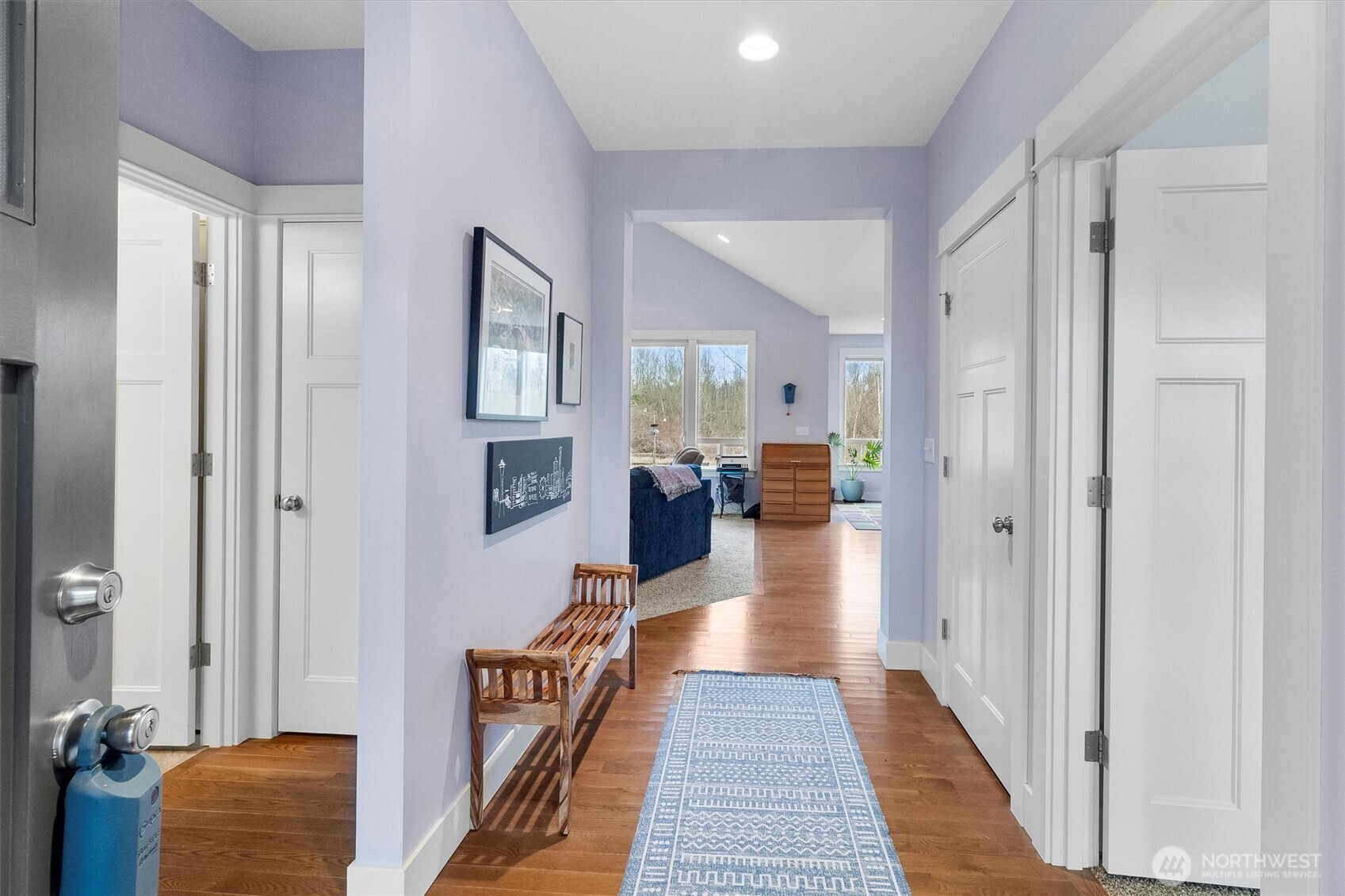 5434 Blue Sky Way Ferndale, WA 98248 - Photo 12 of 39 a hallway with wooden floor a bedroom and windows