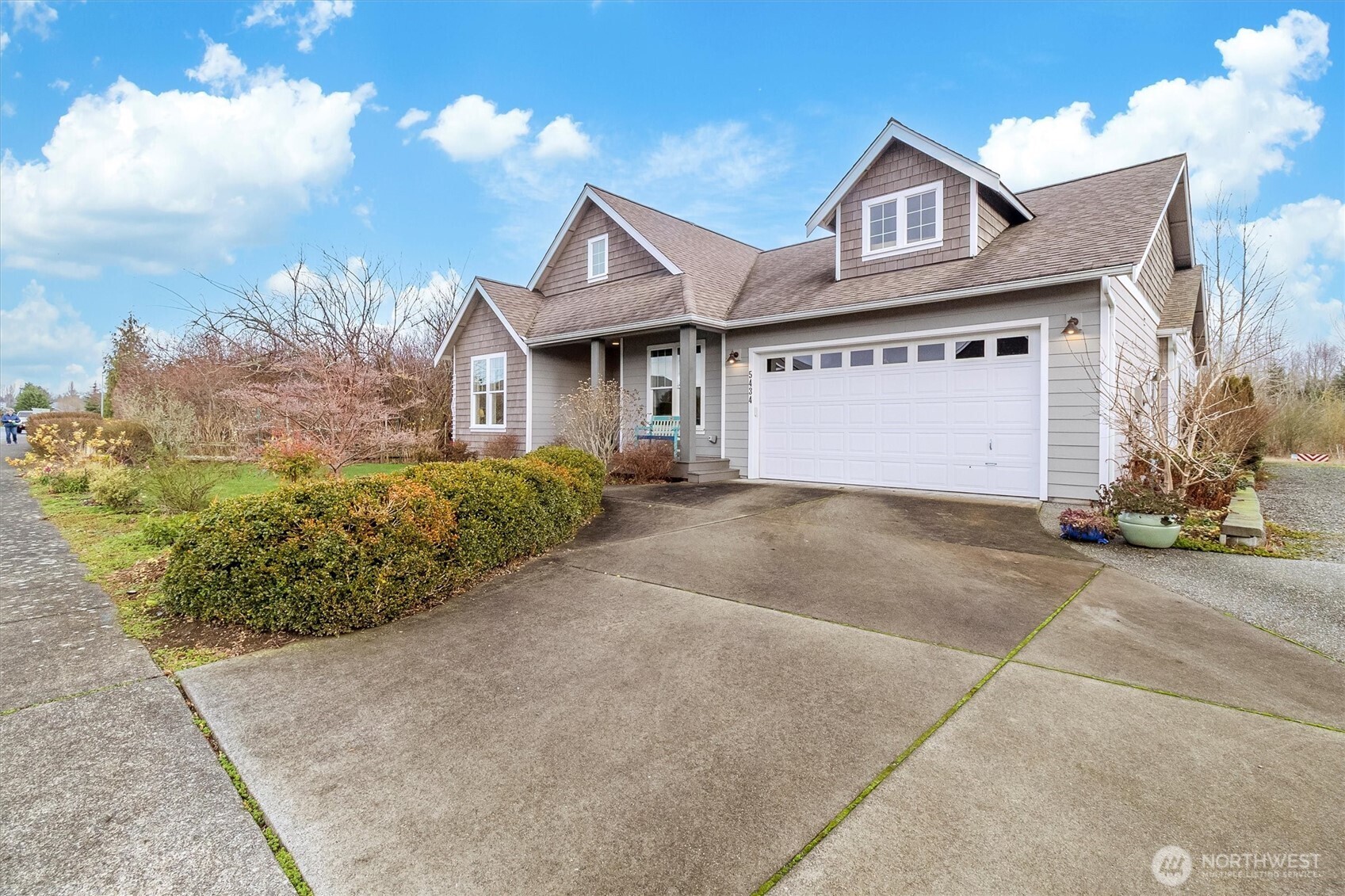 5434 Blue Sky Way Ferndale, WA 98248 - Photo 13 of 39 a front view of a house with a yard and garage