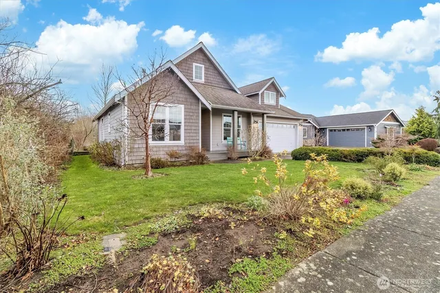 a view of a house with a yard and plants