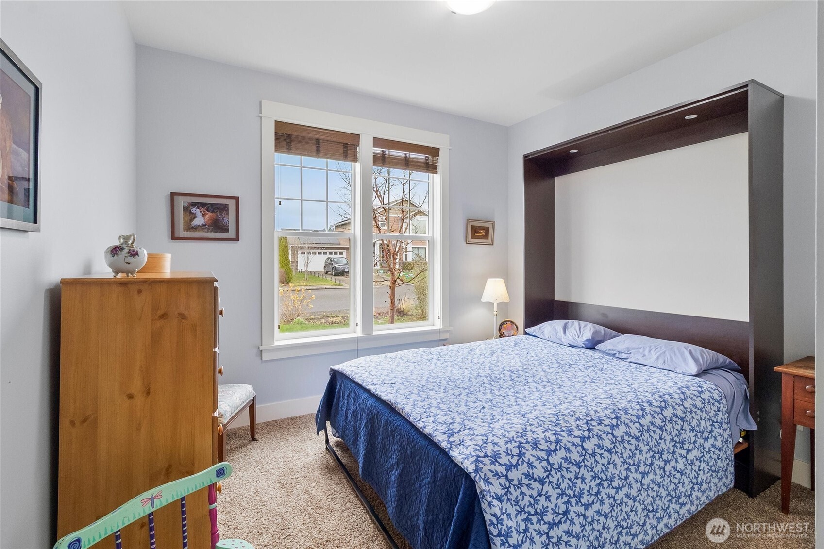 5434 Blue Sky Way Ferndale, WA 98248 - Photo 17 of 39 a bedroom with a bed and a dresser next to a window