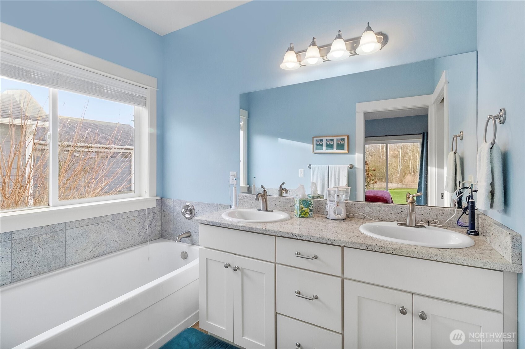 5434 Blue Sky Way Ferndale, WA 98248 - Photo 21 of 39 a bathroom with a tub a sink and mirror