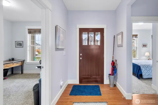 a view of livingroom with hardwood floor and a sink