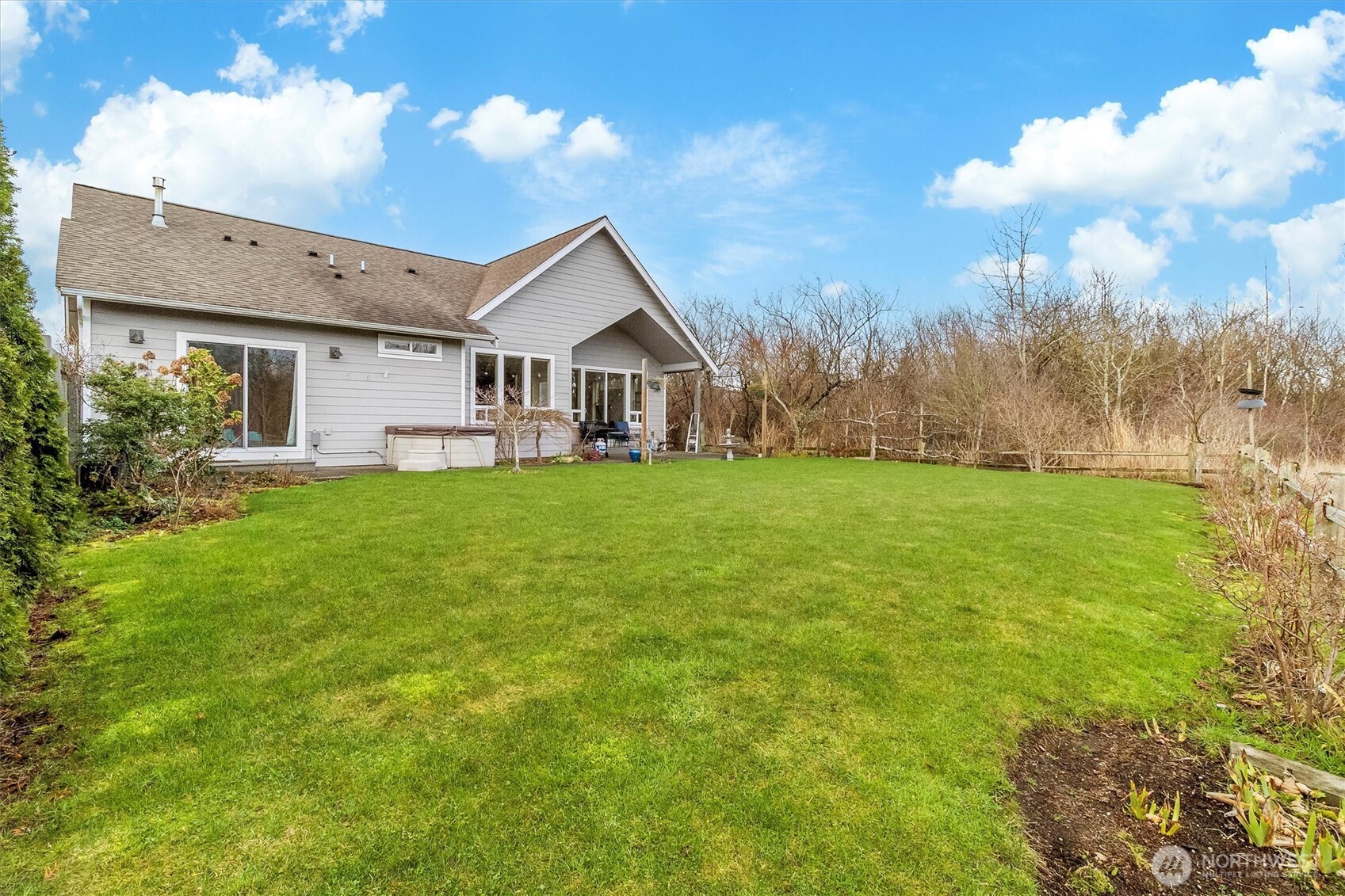 5434 Blue Sky Way Ferndale, WA 98248 - Photo 33 of 39 a view of a house next to a big yard with large trees
