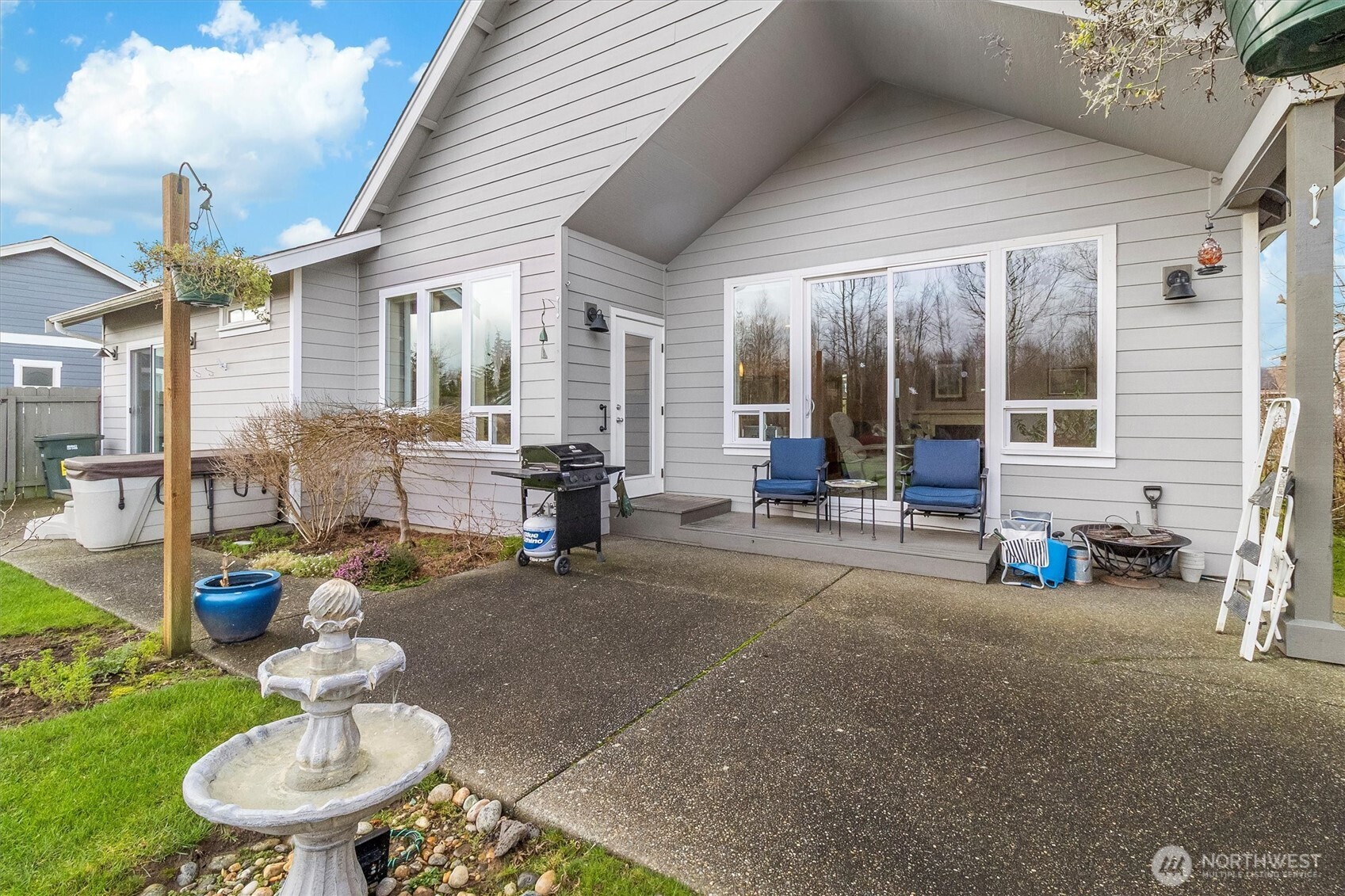 5434 Blue Sky Way Ferndale, WA 98248 - Photo 37 of 39 a backyard of a house with fountain table and chairs