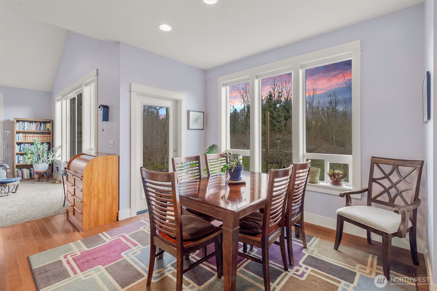 5434 Blue Sky Way Ferndale, WA 98248 - Photo 4 of 39 a view of a dining room with furniture wooden floor and a potted plant