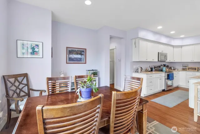 a living room with furniture and kitchen view