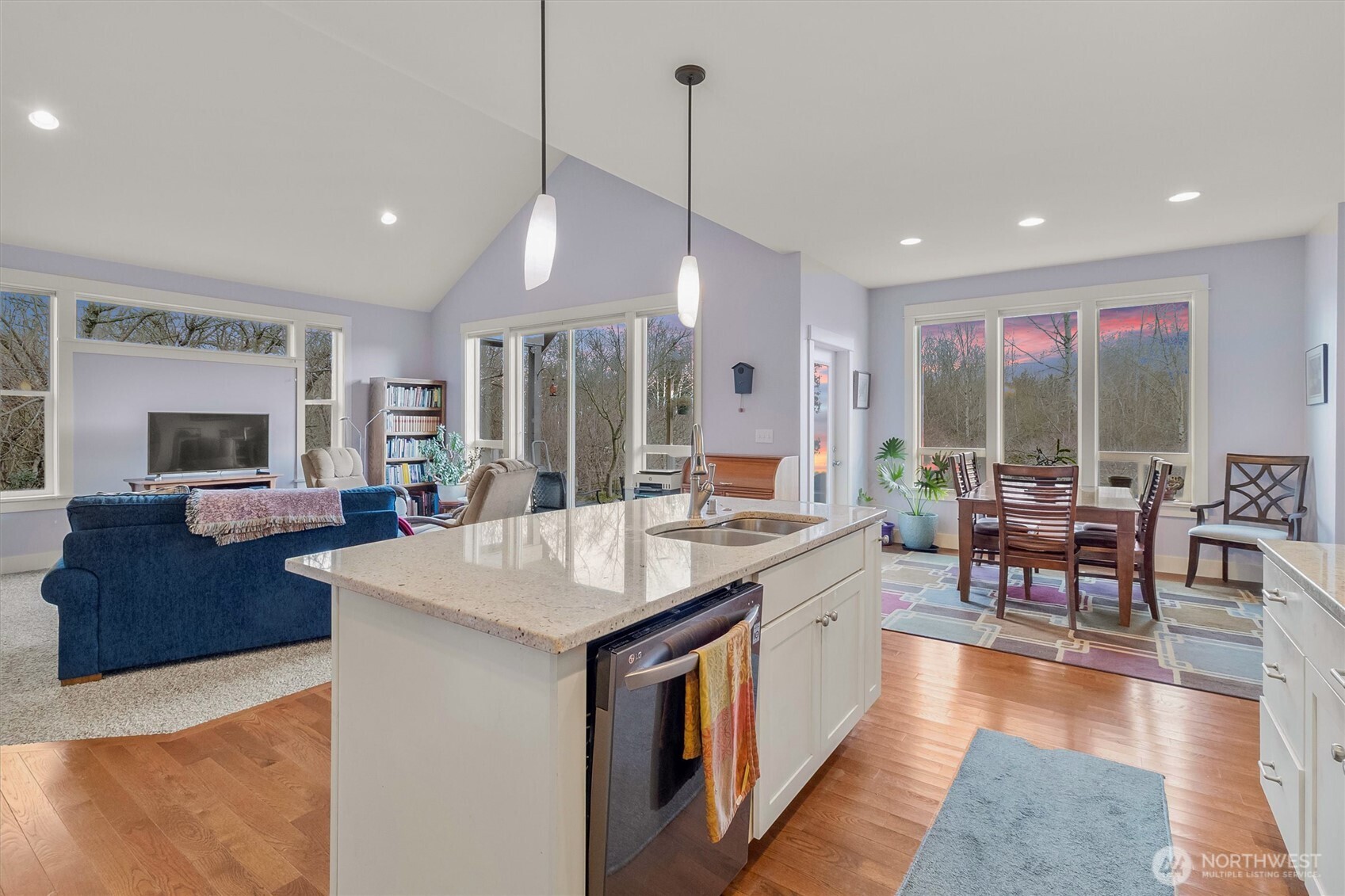 5434 Blue Sky Way Ferndale, WA 98248 - Photo 10 of 39 a large kitchen with kitchen island a island a sink a stove and a large refrigerator