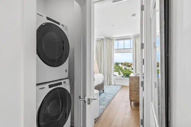 a view of a hallway with washer and dryer