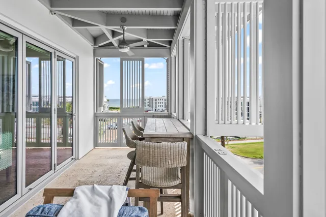 a dining room with furniture and chandelier
