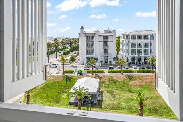a swimming pool with outdoor seating and yard