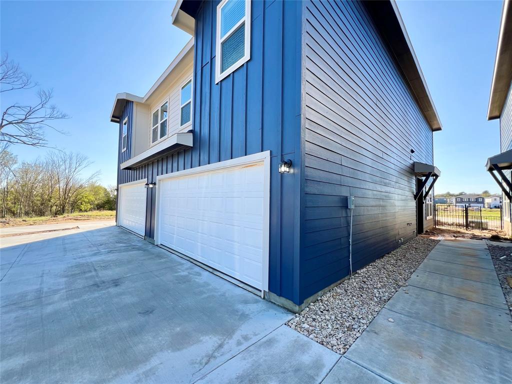 3501 East Renfro Street, Unit 407 Burleson, TX 76028 - Photo 2 of 35 a view of a back yard of the house