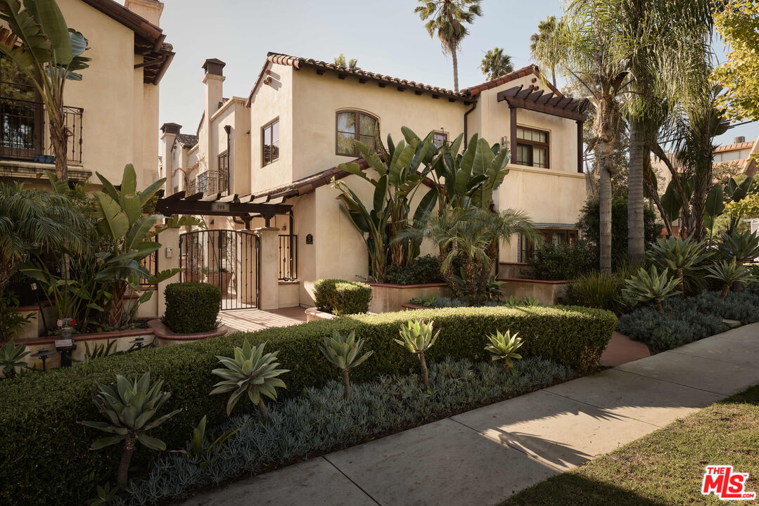 908 17th Street, Unit 8 Santa Monica, CA 90403 - Photo 1 of 15 a view of a house with backyard and sitting area