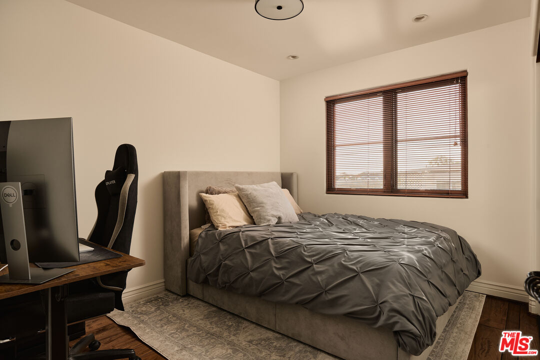 908 17th Street, Unit 8 Santa Monica, CA 90403 - Photo 12 of 15 a bed sitting in a bedroom next to a window