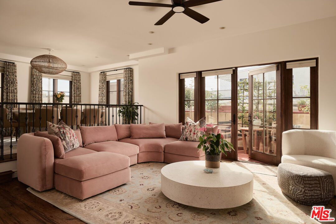 908 17th Street, Unit 8 Santa Monica, CA 90403 - Photo 2 of 15 a living room with furniture and a large window