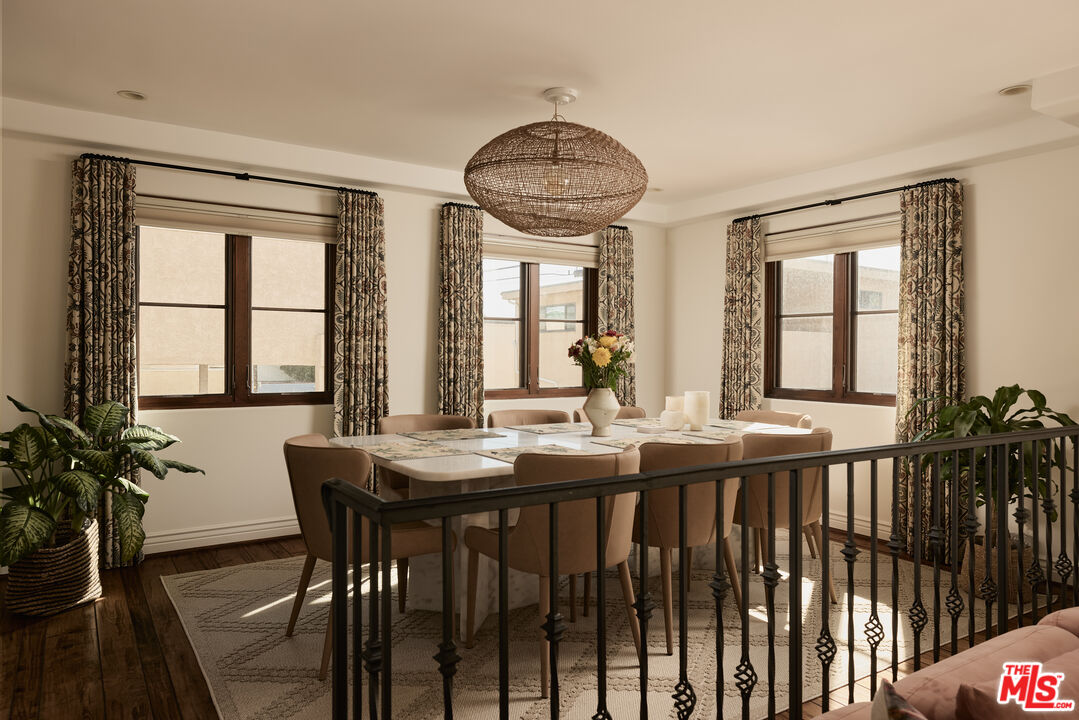 908 17th Street, Unit 8 Santa Monica, CA 90403 - Photo 4 of 15 a view of a a dining room with furniture window and wooden floor