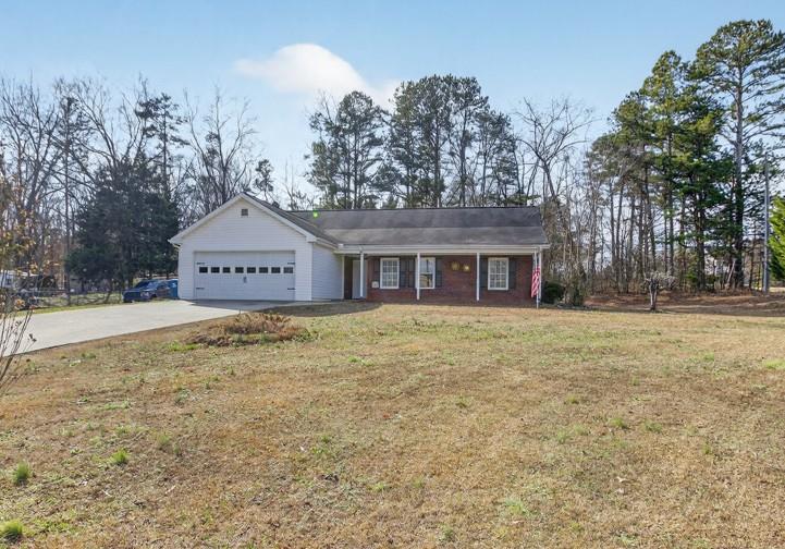 701 Muirfield Drive Winder, GA 30680 - Photo 1 of 35 a front view of a house with a yard