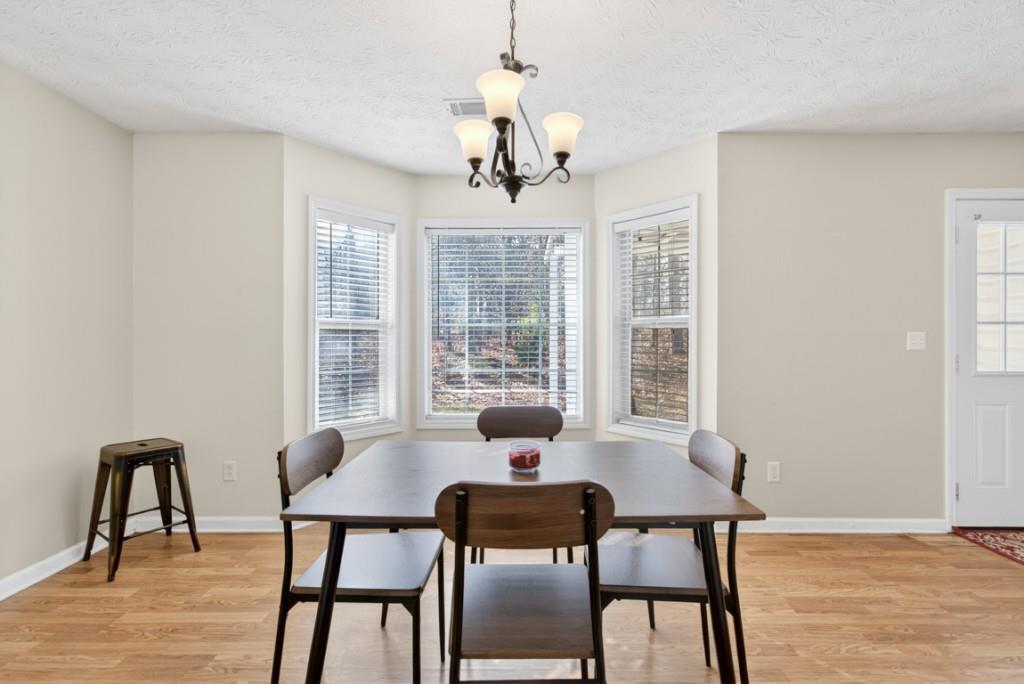701 Muirfield Drive Winder, GA 30680 - Photo 12 of 35 a dining room with furniture and window