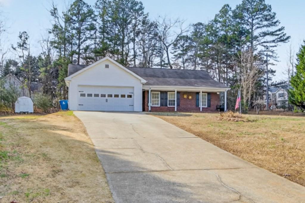 701 Muirfield Drive Winder, GA 30680 - Photo 2 of 35 a front view of a house with a yard