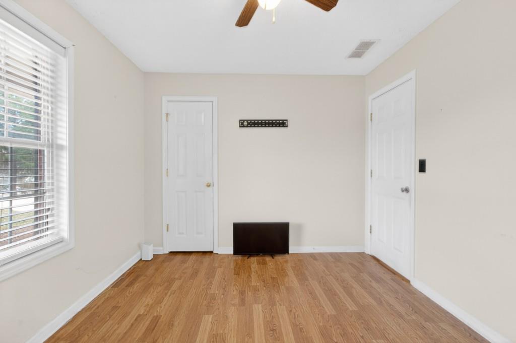 701 Muirfield Drive Winder, GA 30680 - Photo 24 of 35 a view of empty room with wooden floor