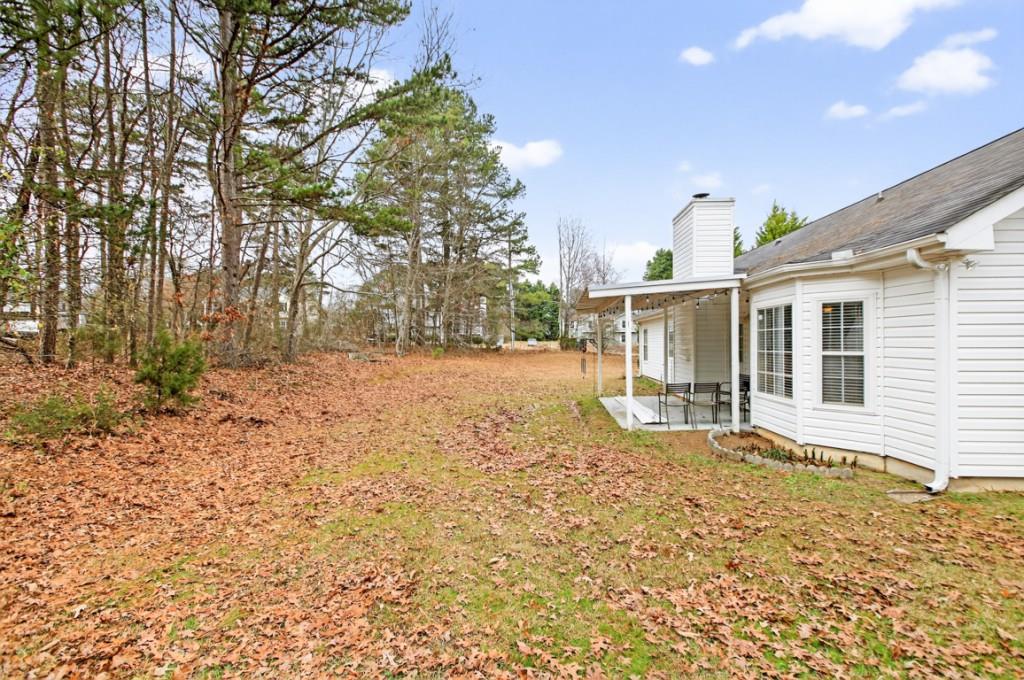 701 Muirfield Drive Winder, GA 30680 - Photo 34 of 35 a view of a house with a yard and sitting area