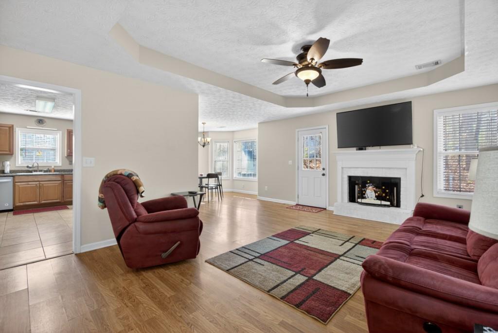 701 Muirfield Drive Winder, GA 30680 - Photo 5 of 35 a living room with furniture and a fireplace
