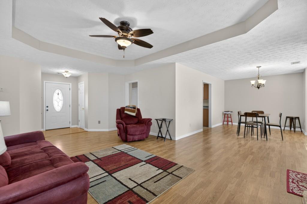 701 Muirfield Drive Winder, GA 30680 - Photo 8 of 35 a living room with furniture and a wooden floor