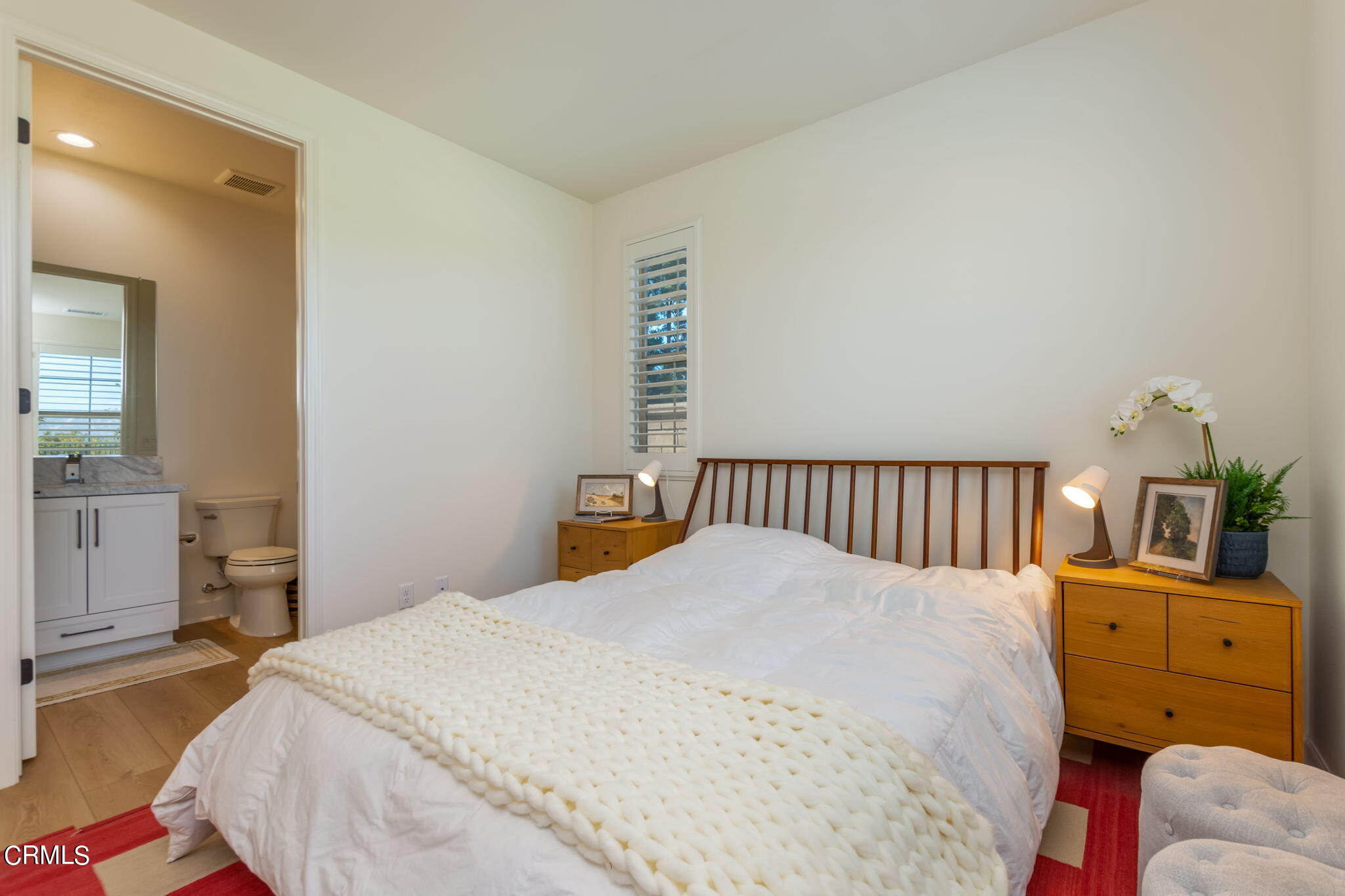 2388 Rondell Road Camarillo, CA 93012 - Photo 12 of 39 a bedroom with a bed and wooden floor