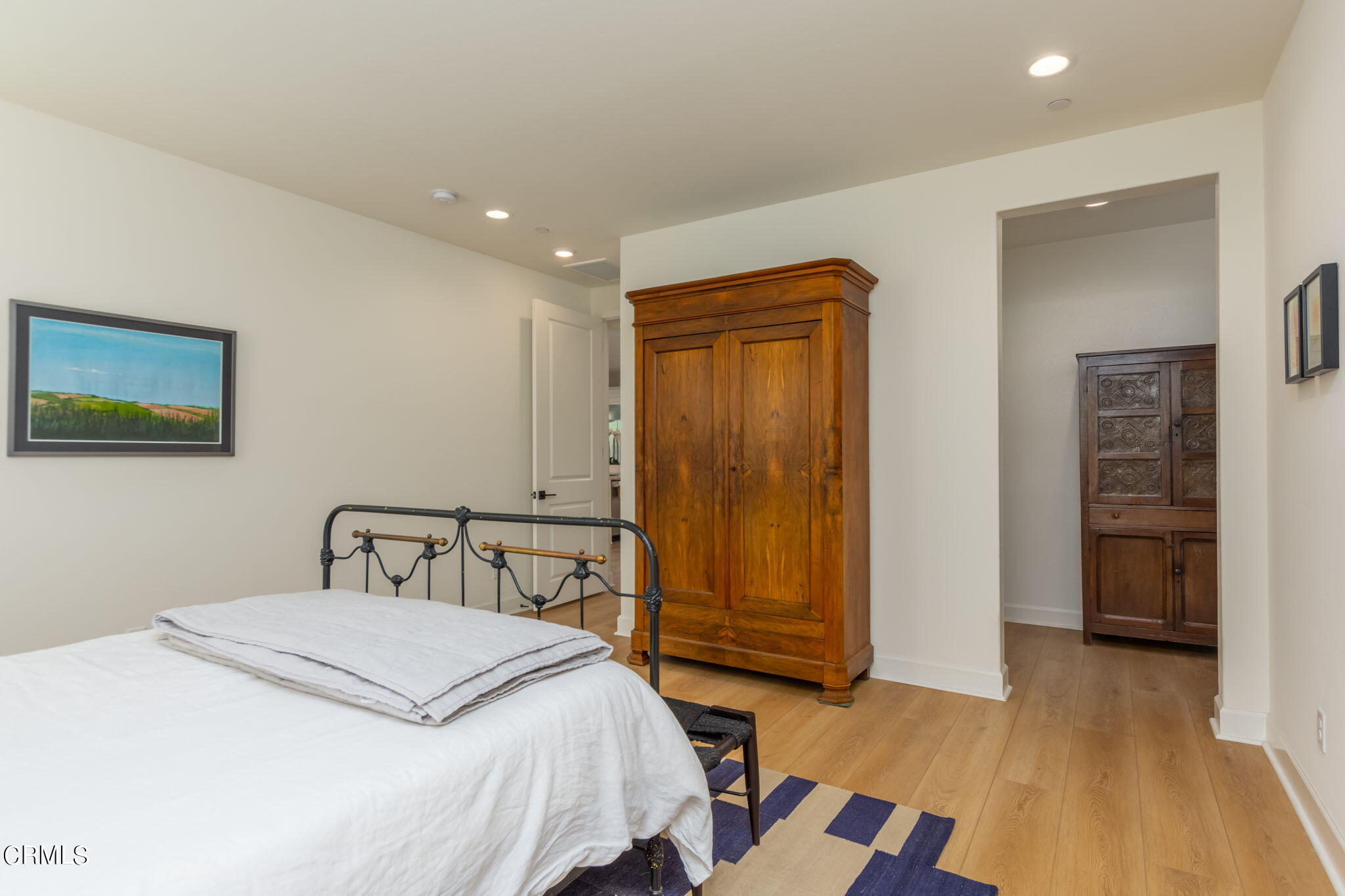 2388 Rondell Road Camarillo, CA 93012 - Photo 15 of 39 a bedroom with a bed and wooden floor
