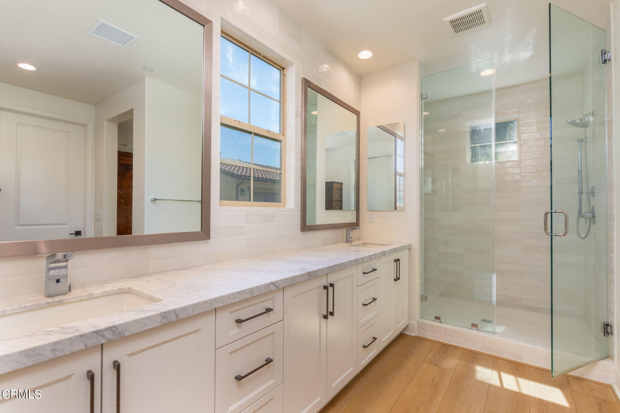 2388 Rondell Road Camarillo, CA 93012 - Photo 16 of 39 a bathroom with a shower sink and mirror