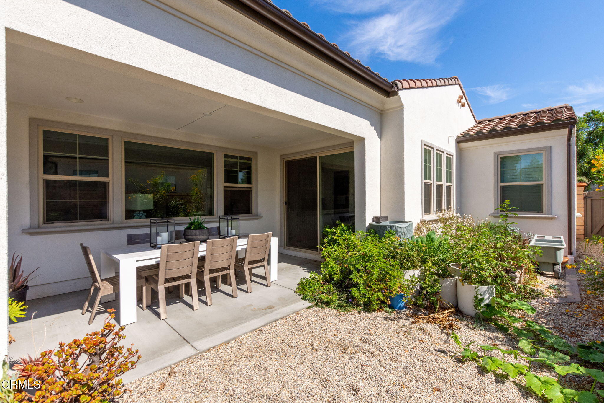 2388 Rondell Road Camarillo, CA 93012 - Photo 17 of 39 a view of a patio with table and chairs and potted plants