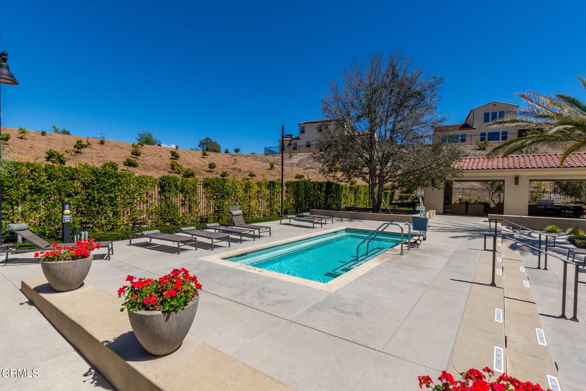 2388 Rondell Road Camarillo, CA 93012 - Photo 28 of 39 a view of a swimming pool with a lounge chairs