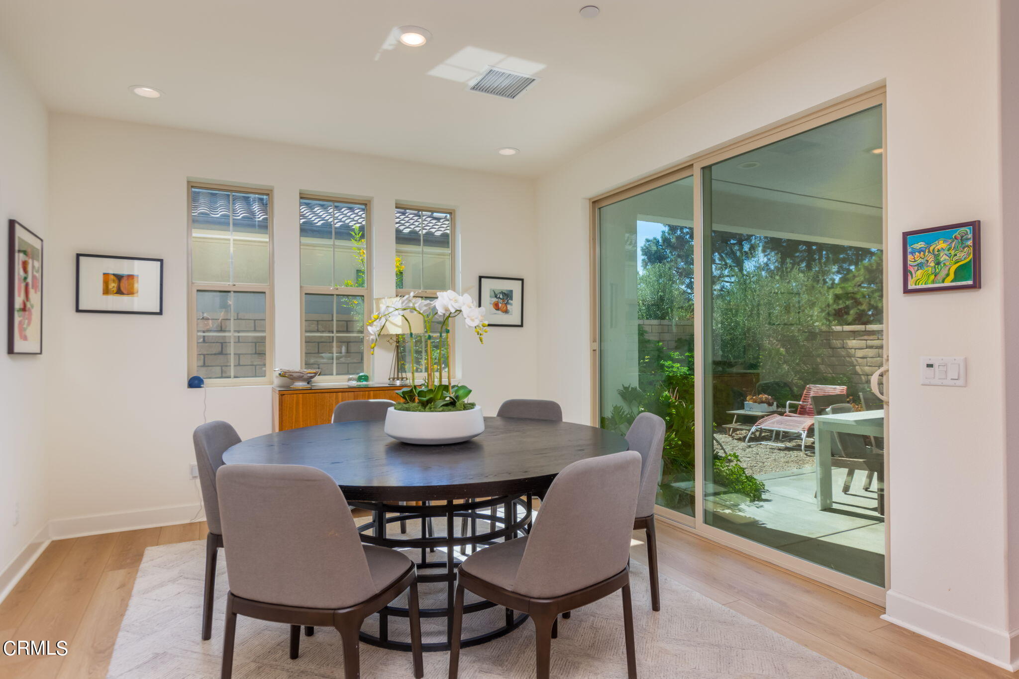 2388 Rondell Road Camarillo, CA 93012 - Photo 10 of 39 a dining room with furniture large windows and wooden floor