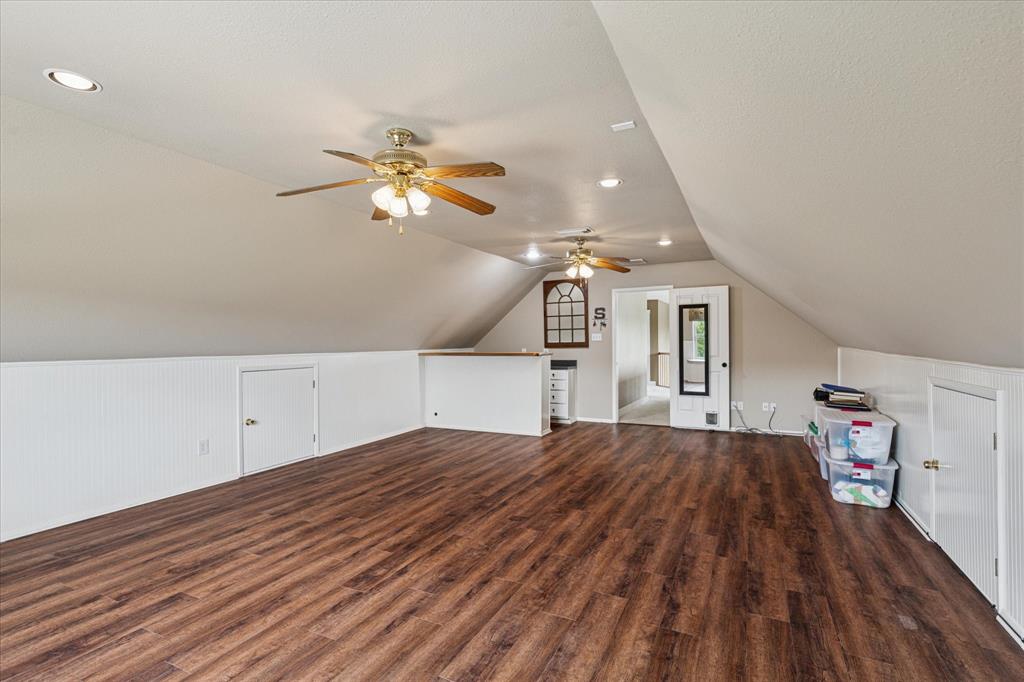 6251 Hayes Road Midlothian, TX 76065 - Photo 12 of 30 a bedroom with a bed and a chandelier