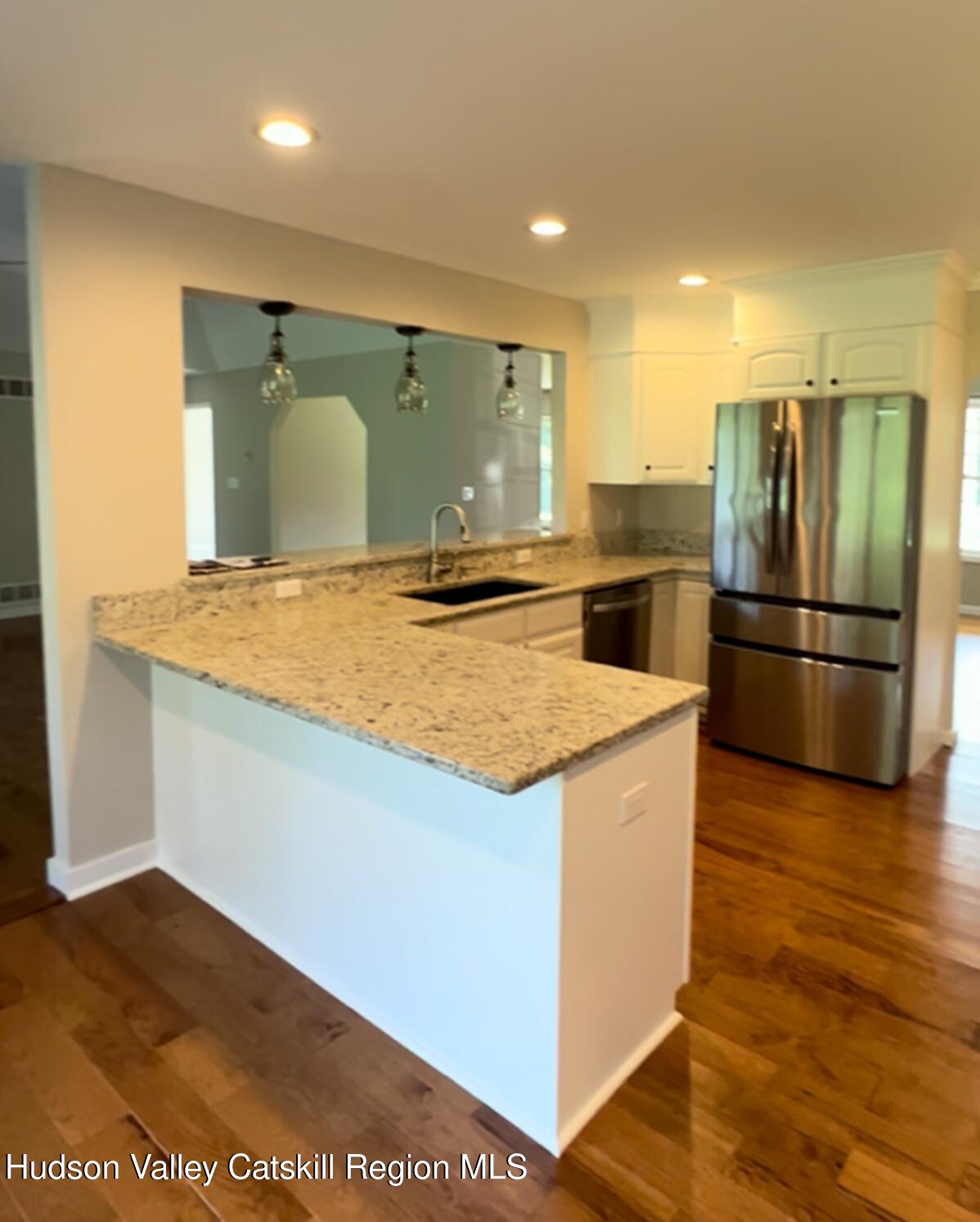 24 Mountain View Road Amenia, NY 12501 - Photo 6 of 13 a kitchen with stainless steel appliances granite countertop a refrigerator and a sink