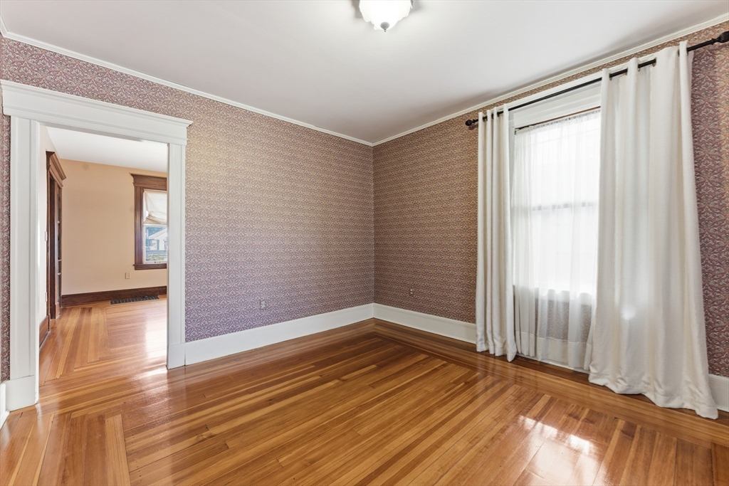 106 Magnolia Terrace Springfield, MA 01108 - Photo 13 of 42 a view of empty room with wooden floor