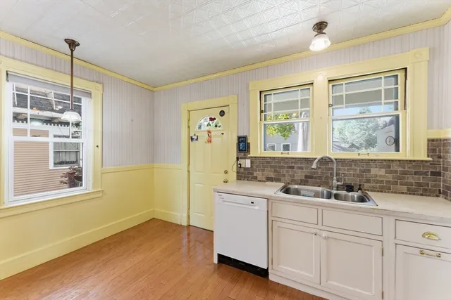 a bathroom with a double vanity sink a mirror and a bathtub