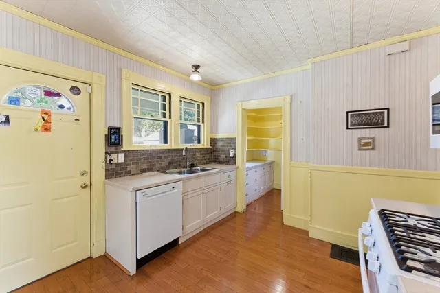 a kitchen with a sink and a refrigerator
